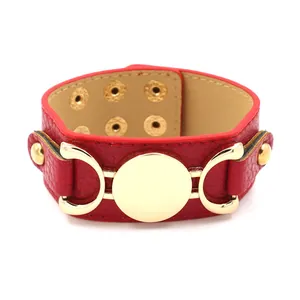 Red PU leather wide cuff bracelet featuring gold buckle detail and adjustable studs