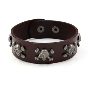 Men's punk dark brown wide leather bracelet with silver skull studs and snap buttons