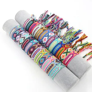Detailed view of colorful woven ethnic friendship bracelets with vibrant geometric patterns