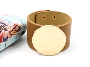 Brown litchi grain leather wide cuff bracelet with large polished gold metal disk