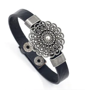 Retro black leather bracelet featuring a vintage hollow circular metal flower pattern charm