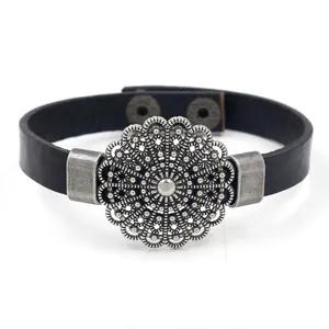 Vintage black leather bracelet with hollow silver floral filigree mandala and snap buttons