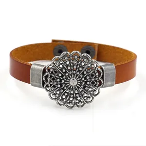 Vintage brown leather bracelet with silver filigree metal disk and snap closure