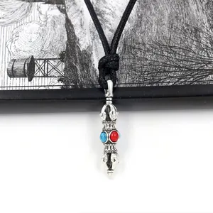 Ethnic vajra pestle necklace with red blue beads on a black woven cord for unisex wear