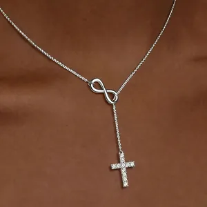 18K gold plated infinity cross necklace with CZ stones worn on neck for a minimalist look