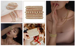 Detailed view of layered 18K gold stainless steel beaded bracelets and necklaces in gift box