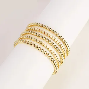 Set of five 18K gold-plated stainless steel bead bracelets with faceted and round textures