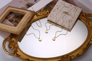 Detailed close-up of double-layer 18K gold plated stainless steel initial letter necklaces
