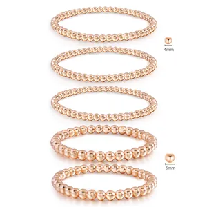 Detail view of 18K rose gold stainless steel bead bracelets in 4mm and 6mm sizes