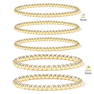 Detail of 4mm and 6mm 18K gold-plated stainless steel beaded stretch bracelets set