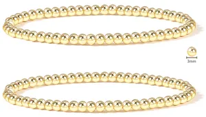 Detailed close-up of 3mm gold stainless steel beaded stretch bracelets in a set of two