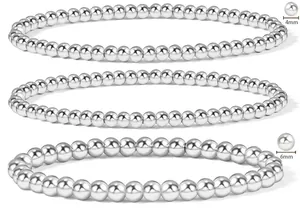 Detail showing 4mm and 6mm polished stainless steel beaded bracelets on white background