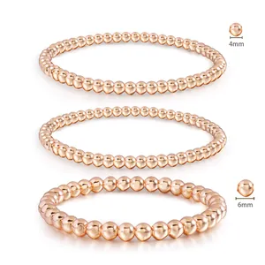 Detailed view of 4mm and 6mm rose gold stainless steel beaded stretch bracelets