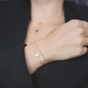Double-layered 18K gold plated stainless steel bracelet with bead chain and round disk pendant