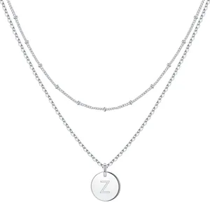 Macro detail of silver double-layer chain necklace with letter Z pendant engraving