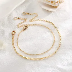 Detail of 18K gold-plated stainless steel double-layer bracelets with a lobster clasp