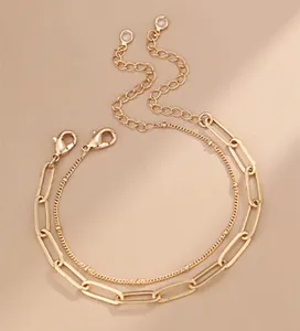 Detail of 18K gold-plated double-layer paperclip and bead chain bracelet with lobster clasp