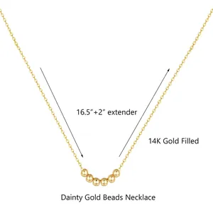 Detail of 14K gold filled necklace with polished beads and 2-inch extension chain
