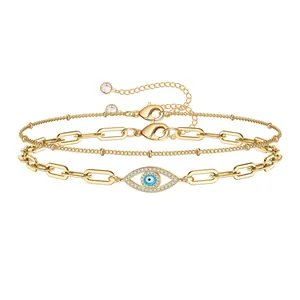 Gold paperclip chain bracelet set with evil eye charm and cubic zirconia accents