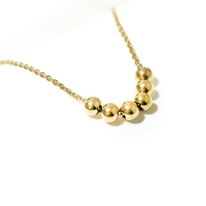 Minimalist 18K gold plated stainless steel necklace featuring six polished sliding beads