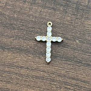 Detail shot of 18K gold plated brass cross pendant with micro-pave 3A cubic zirconia stones
