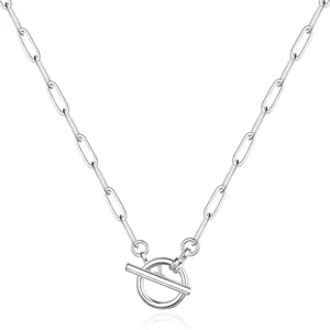 Macro detail of silver paperclip chain necklace with a polished OT toggle clasp