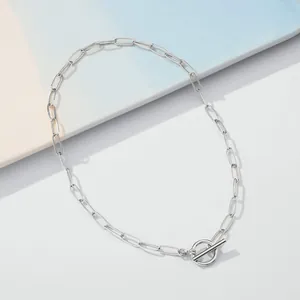 Detail of silver paperclip chain necklace showing the polished OT toggle clasp finish
