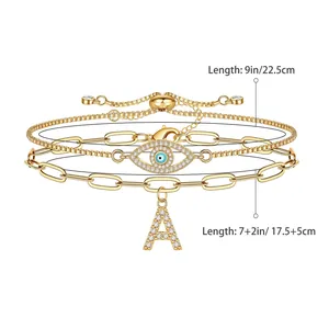 Drie-delige goudvergulde evil eye en letter A armbandset met zirkonia steentjes