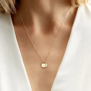 18K gold plated stainless steel double mini coin pendant necklace worn by female model
