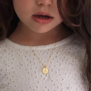 Polished 18K gold plated stainless steel initial A round pendant necklace on child model