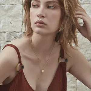 Minimalist 18K gold stainless steel necklace featuring a round letter J pendant charm