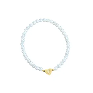 Elegant 18K gold-plated beaded bracelet with imitation pearls and X-engraved heart pendant