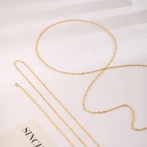 Close-up of 18K gold-plated stainless steel rope chains and beaded layering chains
