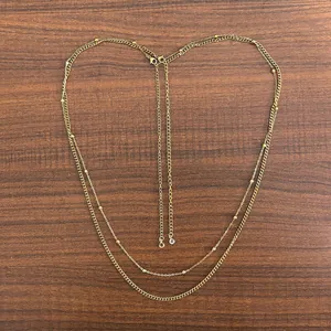 Minimalist double-layer 18K gold plated stainless steel necklace set with beads on wood