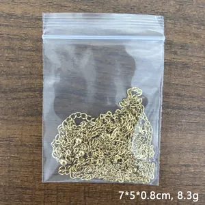 18K gold-plated stainless steel bead chain necklace displayed on a rustic wood surface