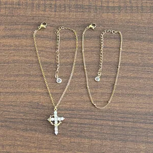 Detail of 18K gold-plated double-layer necklace with sparkling zircon cross pendant