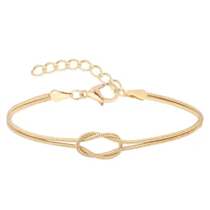 18K gold plated stainless steel double snake chain bracelet with a central knot design