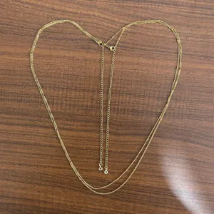 18K gold-plated double-layer stainless steel body chain in a heart shape on wood