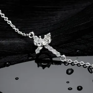 Macro shot of 18K silver crown bracelet featuring micro-pave AAA zircons and water drops