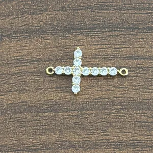 Detail of 18K gold-plated brass cross connector with micro-pave zircons for jewelry making