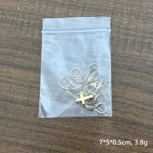 Collana con piccolo ciondolo a croce in acciaio inossidabile dorato 18K e catena