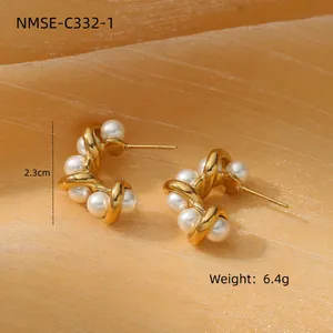 Elegant twisted gold earrings with pearls on silk fabric, 2.3cm height and 6.4g weight