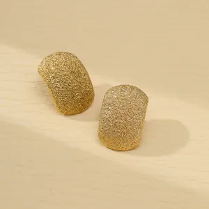 Elegant curved rectangular gold earrings with a fine matte sandblasted metal texture