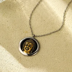 Retro stainless steel round necklace with golden Buddha relief on a textured background