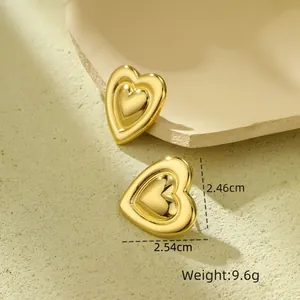 Detailed view of layered gold heart earrings with precise dimensions and weight specs