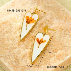 Golden heart drop earrings with orange dried flowers and dimensions 3.7cm by 1.6cm