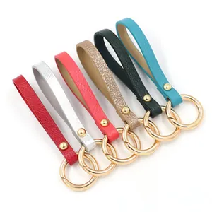 Detailed set of leather keychains in various colors with golden spring ring clasps