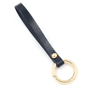 Minimalist black leather wrist lanyard with premium gold-tone metal alloy ring buckle