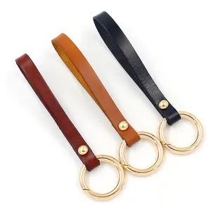 Brown and black leather keychains with golden spring rings in three colors