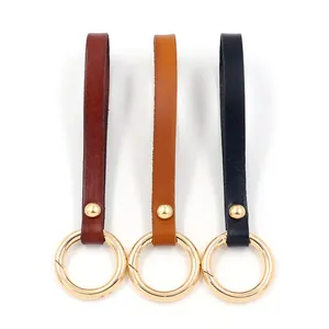 Brown leather key ring lanyard set with golden alloy rings in red yellow and black